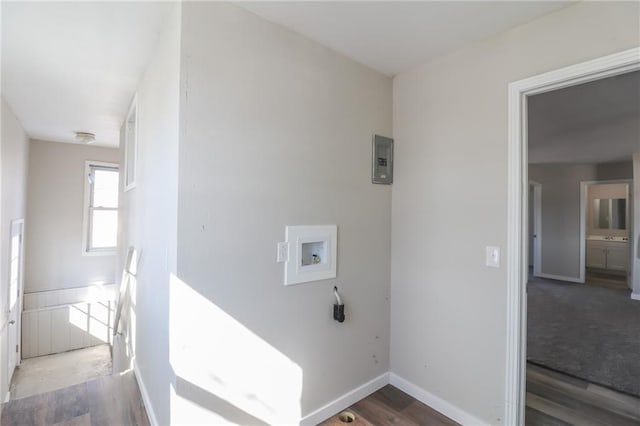 washroom featuring laundry area, baseboards, washer hookup, and wood finished floors