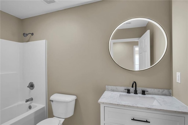 bathroom with toilet, shower / washtub combination, and vanity