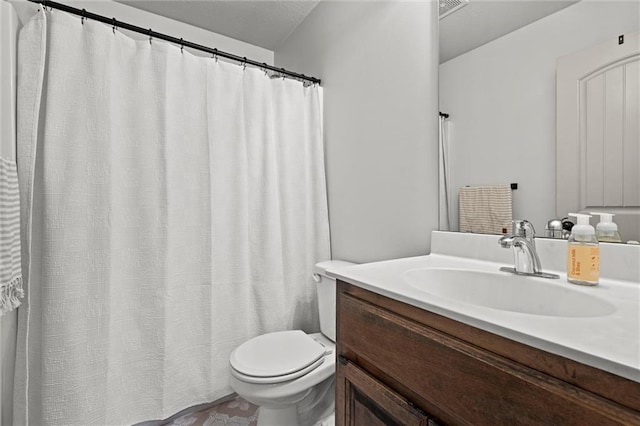 full bathroom featuring toilet and vanity