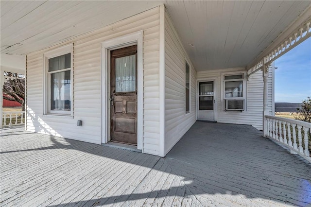 entrance to property featuring cooling unit