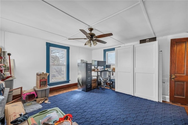 interior space featuring a ceiling fan and a wealth of natural light