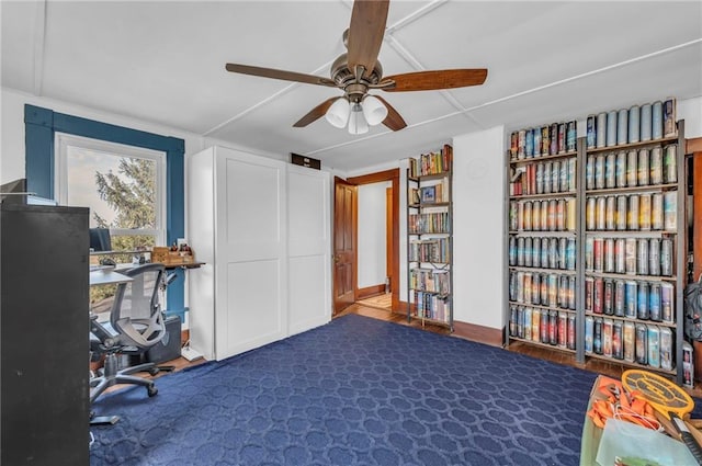 carpeted office with ceiling fan