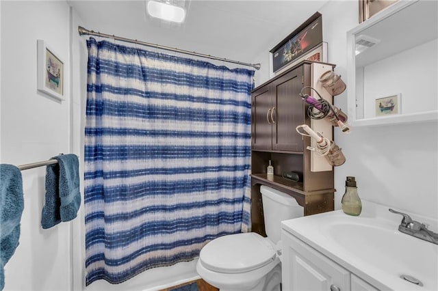 full bath with visible vents, toilet, vanity, and a shower with curtain