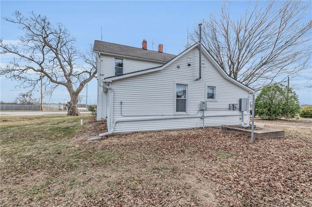 exterior space featuring a chimney