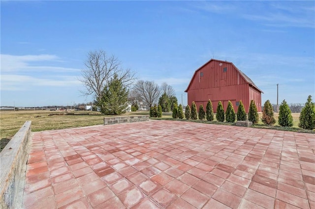 view of patio / terrace with a barn and an outdoor structure