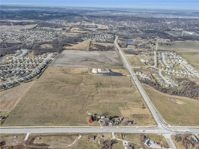 birds eye view of property with a rural view