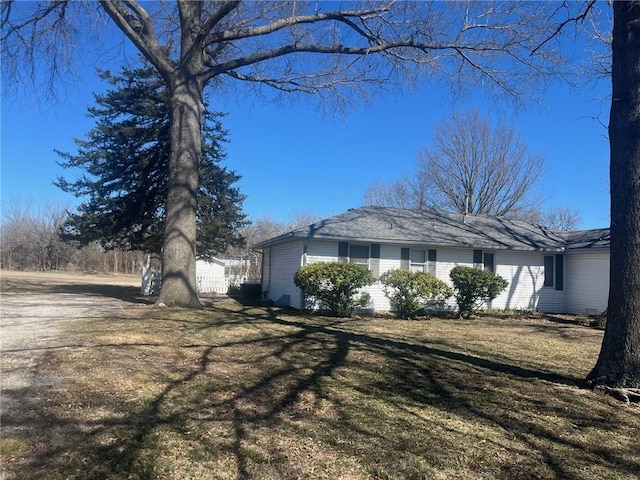 view of property exterior featuring a yard