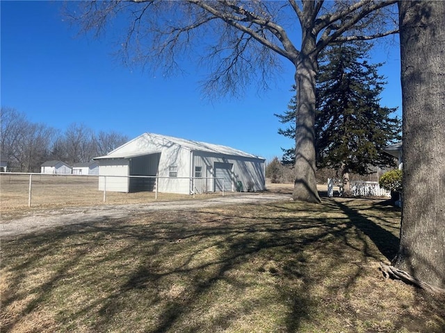 exterior space featuring a lawn and fence