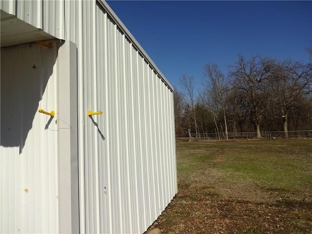 view of outdoor structure with fence