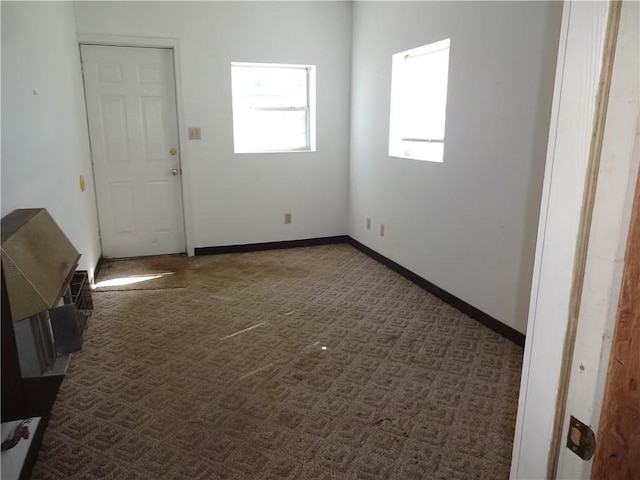 empty room with carpet flooring and baseboards