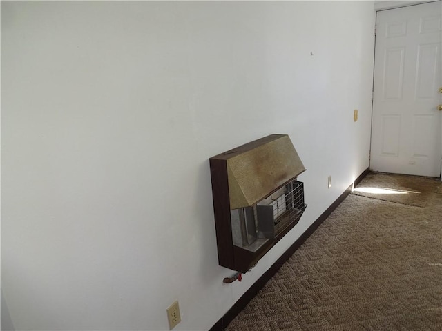 corridor with carpet and baseboards