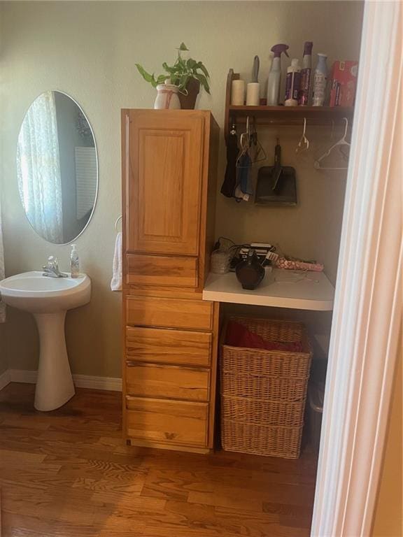 bathroom featuring baseboards and wood finished floors