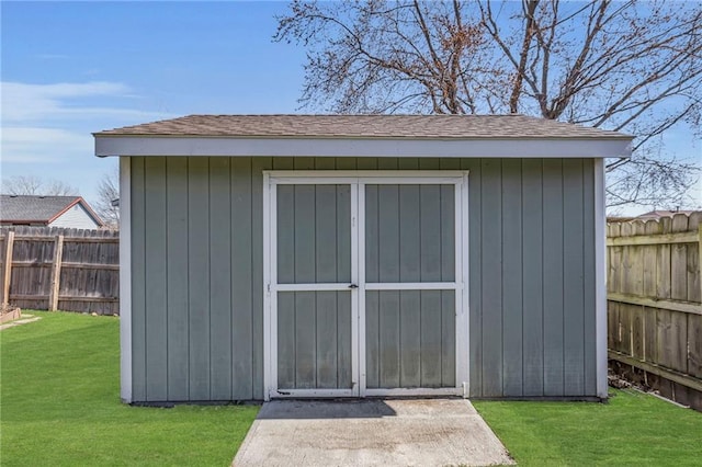 view of shed featuring a fenced backyard