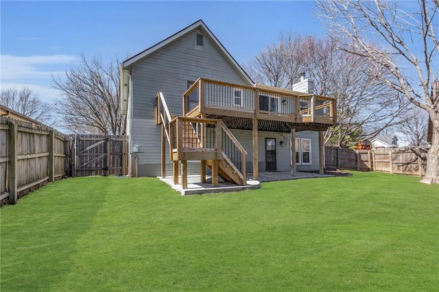 rear view of property with a wooden deck, a fenced backyard, stairs, and a gate