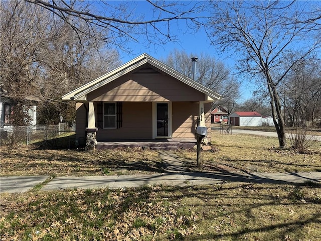 bungalow featuring a porch and fence