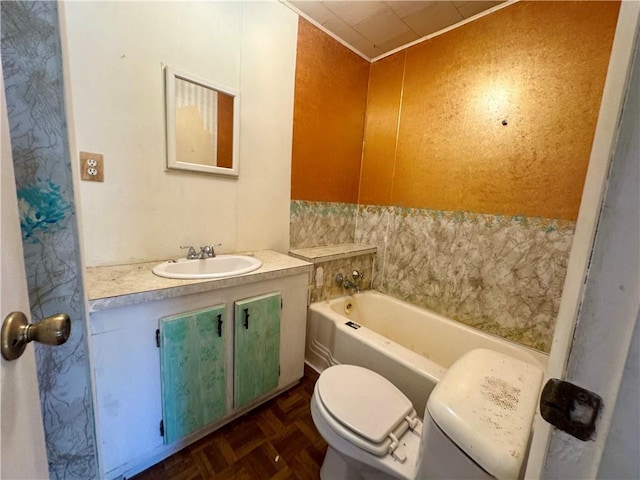 full bathroom featuring a washtub, vanity, and toilet