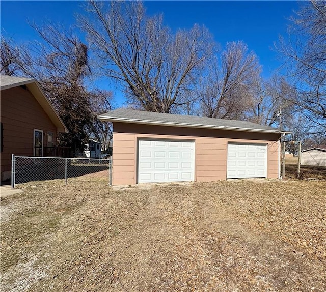 detached garage with fence