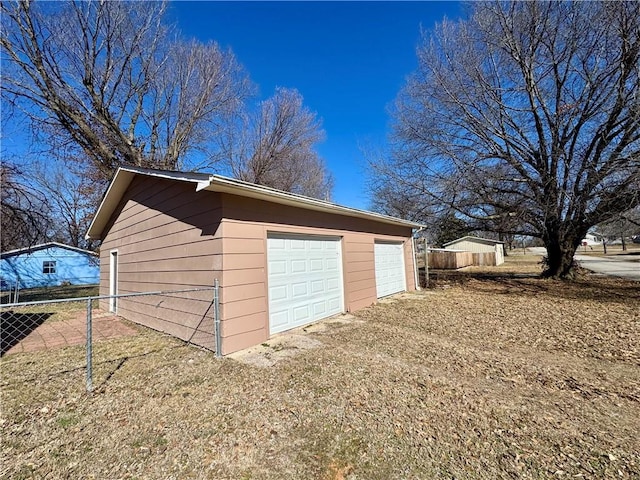 detached garage with fence