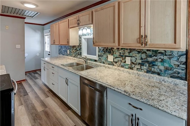 kitchen featuring tasteful backsplash, appliances with stainless steel finishes, crown molding, light brown cabinetry, and a sink