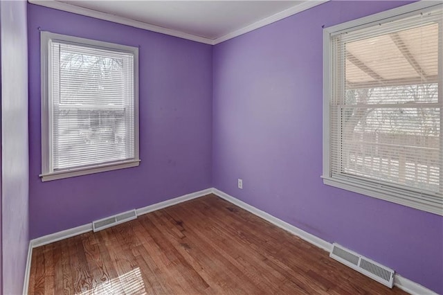 empty room featuring visible vents and a wealth of natural light