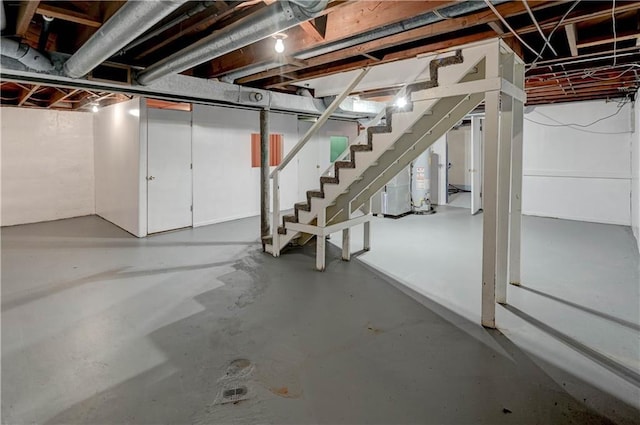 unfinished basement featuring stairs