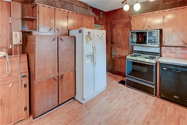 kitchen with black dishwasher, white fridge with ice dispenser, light wood-style flooring, and electric range