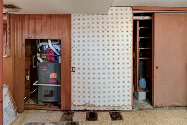 interior space featuring wood walls