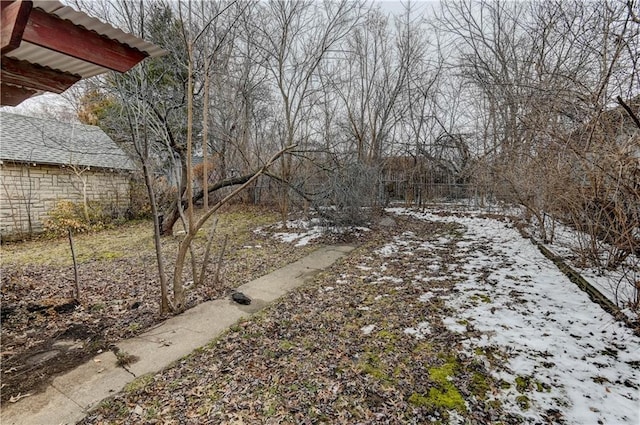 view of yard layered in snow