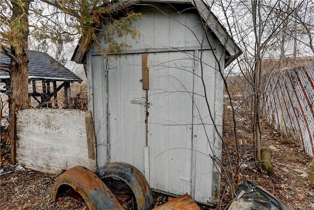 view of shed with fence