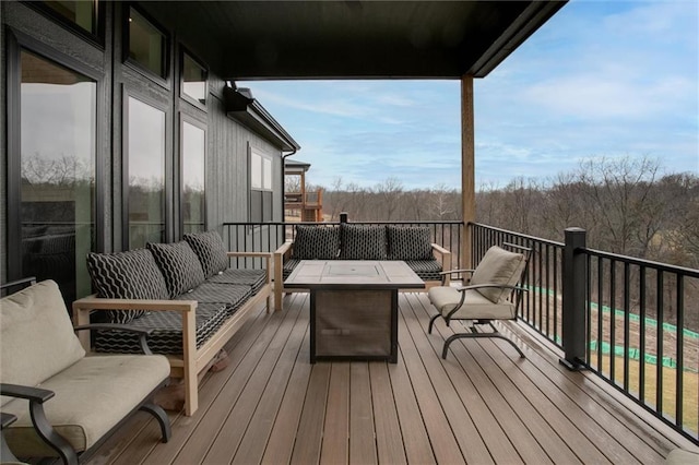 wooden deck featuring an outdoor hangout area