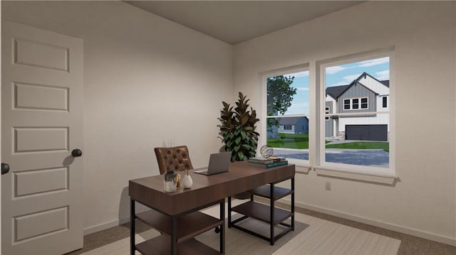 home office featuring light carpet and baseboards