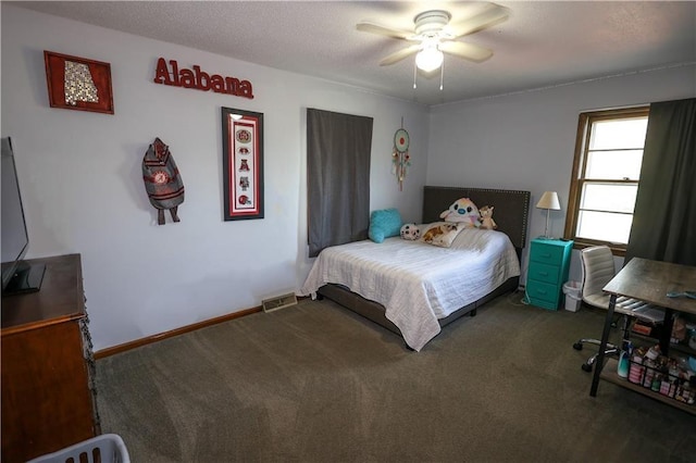 carpeted bedroom featuring a ceiling fan, baseboards, visible vents, and a textured ceiling