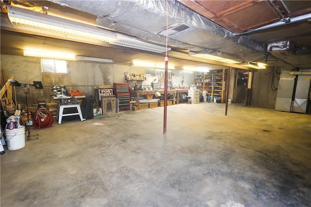 basement with heating unit and a workshop area