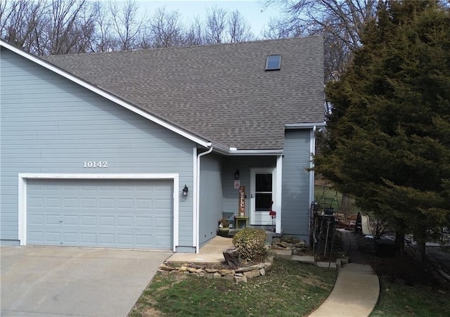 view of front facade featuring an attached garage, roof with shingles, and driveway