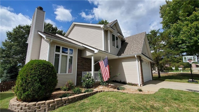 view of front of house featuring driveway, roof with shingles, a front yard, an attached garage, and a chimney