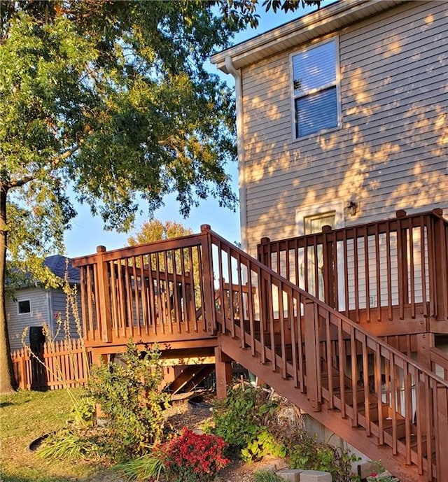 wooden deck featuring stairway and fence