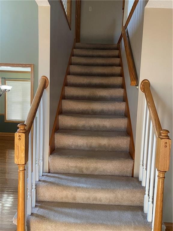 stairs with wood finished floors