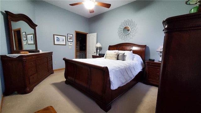 bedroom with baseboards, light colored carpet, and a ceiling fan