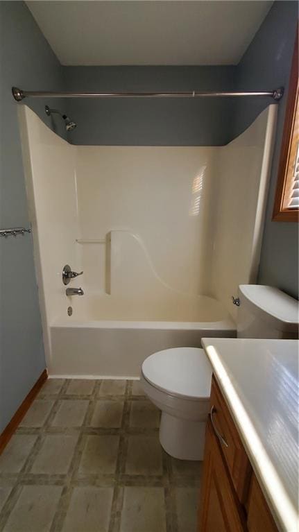 full bath with toilet, vanity, and  shower combination