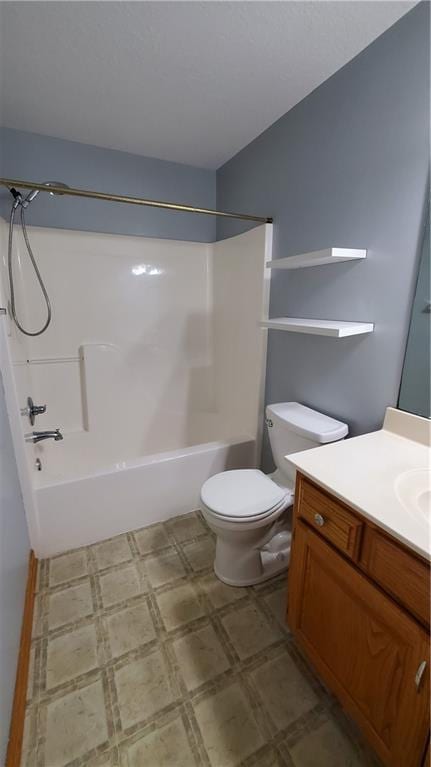 full bath with vanity, tile patterned floors, toilet, and washtub / shower combination