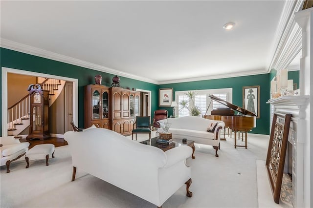 living area with a fireplace, stairway, light colored carpet, and ornamental molding