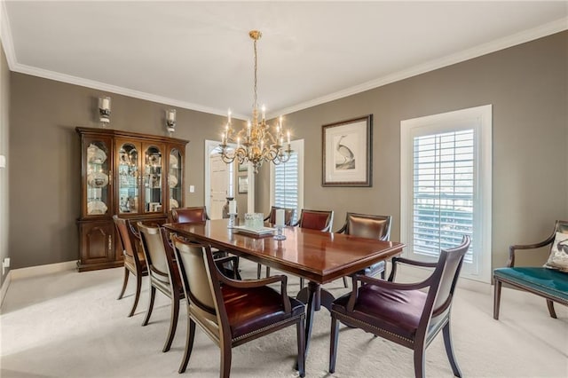 dining area featuring light colored carpet, crown molding, and an inviting chandelier