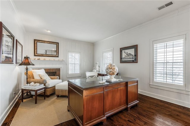 home office with baseboards, dark wood finished floors, a fireplace, and crown molding