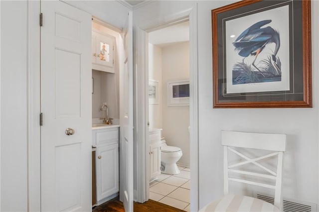 bathroom with tile patterned floors, toilet, and vanity