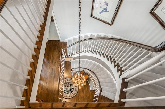 stairway featuring an inviting chandelier