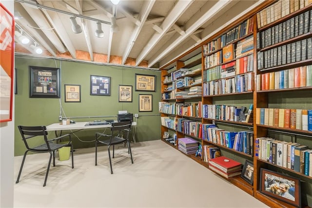 home office featuring concrete flooring