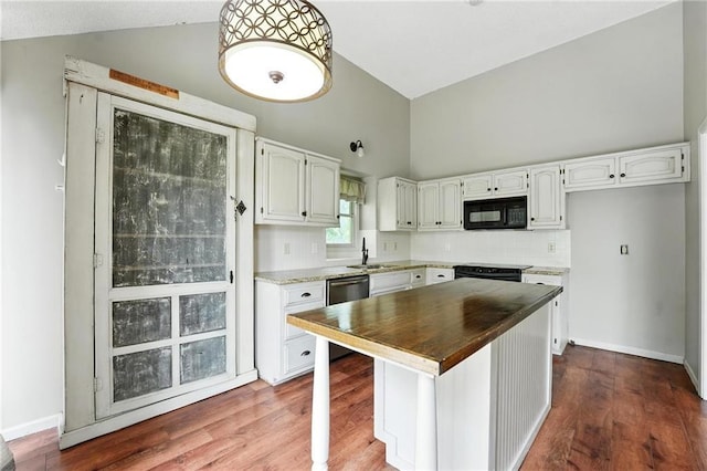 906 N Cedarcrest Dr, Olathe, KS 66061 - kitchen featuring black microwave, high vaulted ceiling, white cabinets, wood counters, and wood finished floors