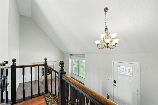 906 N Cedarcrest Dr, Olathe, KS 66061 - foyer featuring a chandelier, lofted ceiling, and wood finished floors