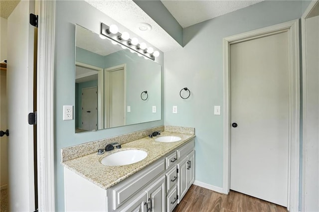 906 N Cedarcrest Dr, Olathe, KS 66061 - bathroom with double vanity and wood finished floors