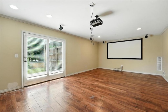 906 N Cedarcrest Dr, Olathe, KS 66061 - home theater room with ornamental molding, wood-type flooring, and recessed lighting
